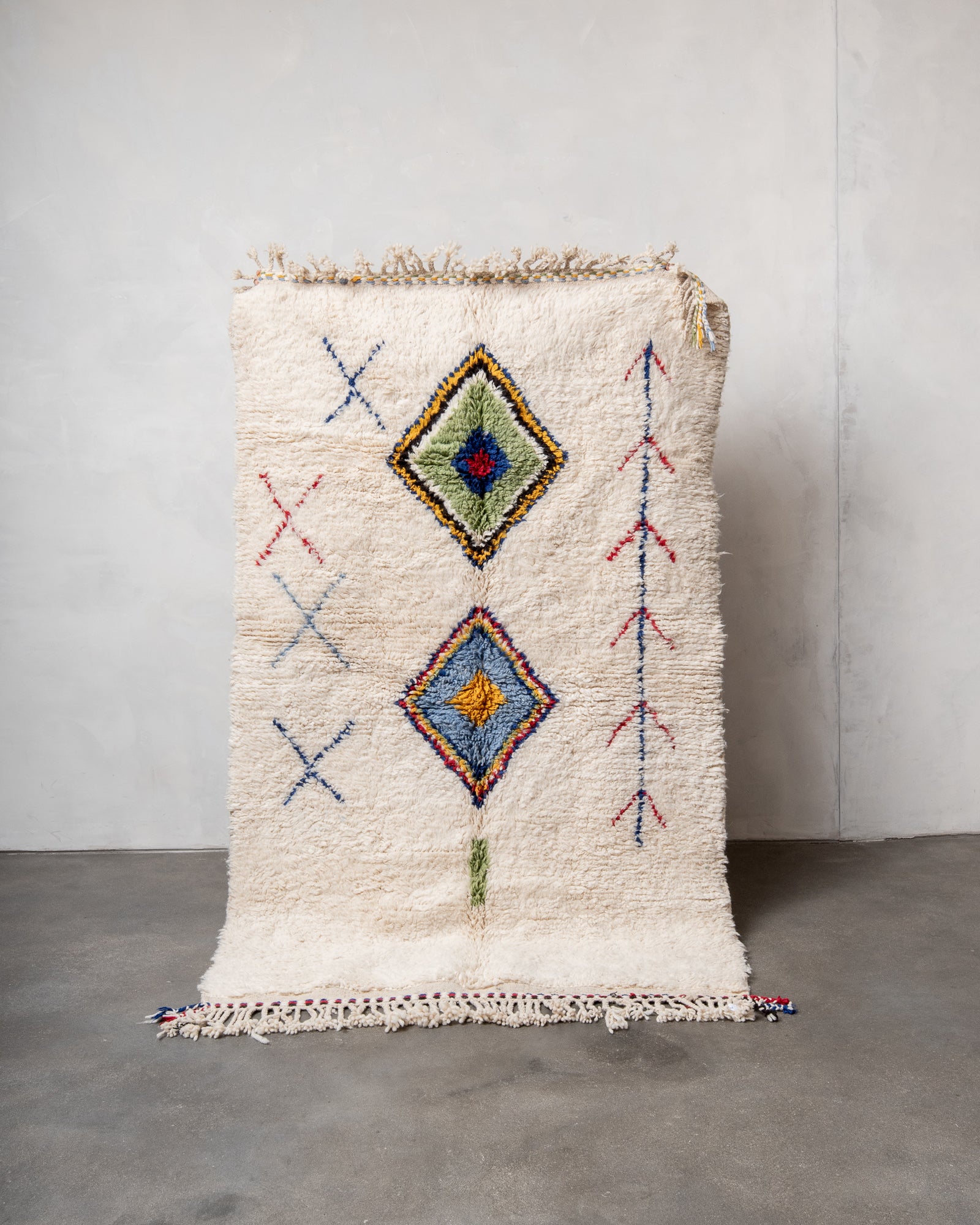 Modern, designer, handcrafted Berber rug from Morocco. Beniourain carpet with beautiful colours and patterns and fluffy wool texture.